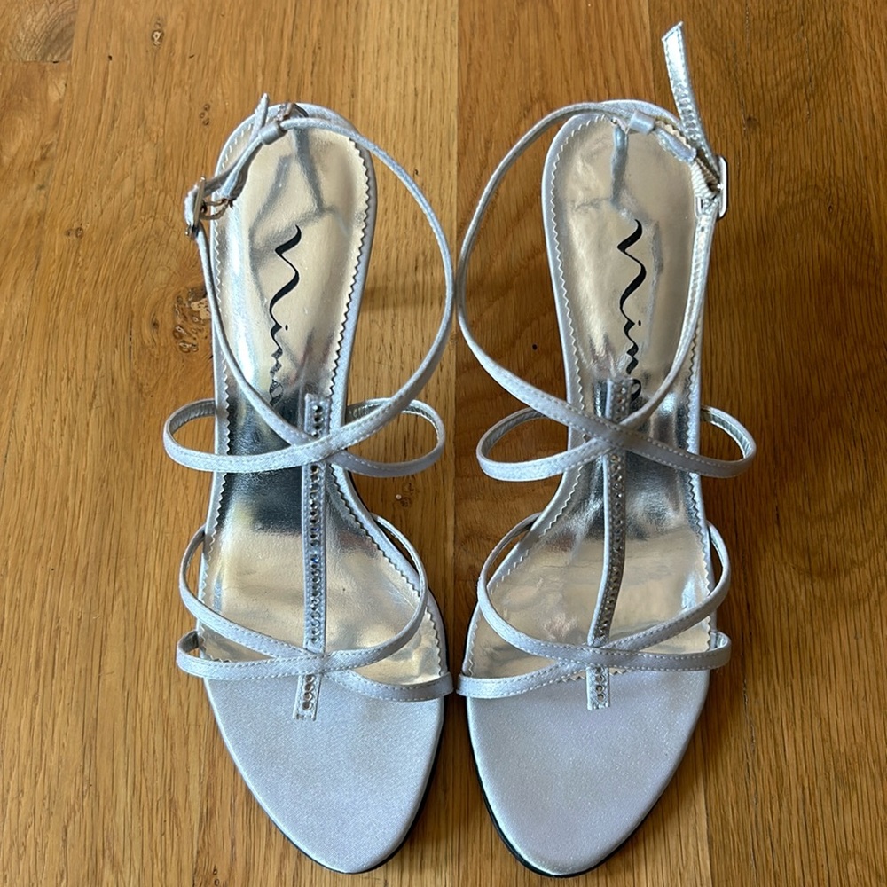 Nina silver dress sandals with rhinestone details on straps and heel. Size 7.5